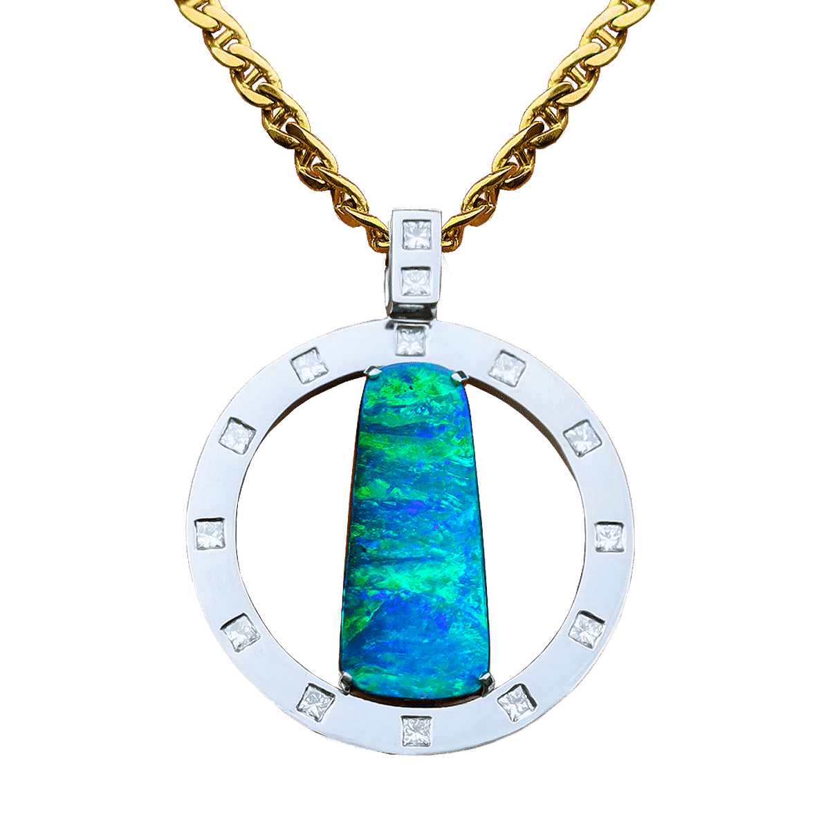 A front on view of an Australian boulder opal pendant on dark blue background. The pendant comprises a large rectangular boulder opal and a flat ring made of platinum. The green-blue boulder opal is set vertically within the ring and held in place by four claws. The platinum ring is decorated by 12 princess cut white diamonds, with equal distances between them. The rectangular bail is attached to the top of the ring and is embellished with 2 more princess cut diamonds.